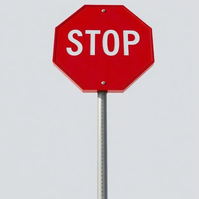 Red octagonal STOP sign on a pole